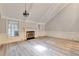 Cozy living room with a fireplace, lots of light, and light, modern flooring at 440 Forestgate Ct, Atlanta, GA 30350
