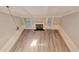 Lofted view of the living room featuring lots of light, high ceilings, and a fireplace at 440 Forestgate Ct, Atlanta, GA 30350