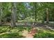 Long private driveway lined with a classic white fence leads to a beautiful home at 980 Hightower Trl, Sandy Springs, GA 30350