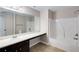 Bathroom with white shower/tub, dark cabinets, and a white countertop and sink at 1212 Ithaca Dr, Mcdonough, GA 30253