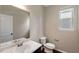 Bathroom featuring a vanity with marble countertop and window at 1212 Ithaca Dr, Mcdonough, GA 30253