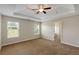This bedroom is spacious and provides plenty of natural light at 1212 Ithaca Dr, Mcdonough, GA 30253
