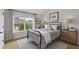 This bedroom has a large window and neutral color palette at 1212 Ithaca Dr, Mcdonough, GA 30253