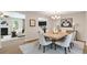 Elegant dining area with stylish lighting, neutral decor, and seamless access to other living spaces at 1212 Ithaca Dr, Mcdonough, GA 30253
