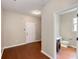 Entryway with hardwood floors leading to a half bathroom at 1212 Ithaca Dr, Mcdonough, GA 30253