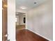 Welcoming foyer with hardwood floors leading to an open floor plan and lots of natural light at 1212 Ithaca Dr, Mcdonough, GA 30253