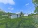 Expansive backyard with outbuildings, offering ample space for outdoor activities and storage at 14367 Fincher Rd, Canton, GA 30114