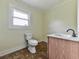 Bathroom with toilet and vanity with wood cabinets at 14367 Fincher Rd, Canton, GA 30114