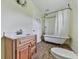 Bathroom featuring a vanity, toilet and a classic claw foot bathtub with shower at 14367 Fincher Rd, Canton, GA 30114