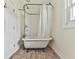 Close up on a classic claw foot tub with shower fixture at 14367 Fincher Rd, Canton, GA 30114