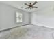 Bedroom featuring carpet flooring, a ceiling fan and a window at 14367 Fincher Rd, Canton, GA 30114