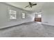 Living room with carpet and access to an exterior door and kitchenette at 14367 Fincher Rd, Canton, GA 30114
