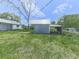 View of multiple outbuildings on the property with metal roofs and siding at 14367 Fincher Rd, Canton, GA 30114