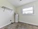 Small utility room with tile flooring, storage shelves and a window at 14367 Fincher Rd, Canton, GA 30114