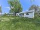 Lush green yard surrounding a charming home, providing a picturesque and inviting outdoor space at 14367 Fincher Rd, Canton, GA 30114