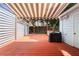 Outdoor deck featuring a striped awning, providing shade and comfortable backyard retreat at 1481 Bentley Se Ln, Marietta, GA 30067
