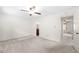 A bright bedroom with light walls and neutral carpeting with connected bath at 1481 Bentley Se Ln, Marietta, GA 30067