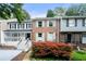 Charming brick townhome with light blue shutters and a well-manicured front yard at 1481 Bentley Se Ln, Marietta, GA 30067