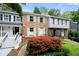 A charming brick townhome featuring a well-kept lawn and vibrant landscaping at 1481 Bentley Se Ln, Marietta, GA 30067