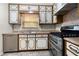 The kitchen features stainless steel appliances, including a double oven and dishwasher at 1481 Bentley Se Ln, Marietta, GA 30067