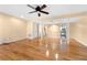Expansive room with hardwood flooring, neutral walls, and modern ceiling fan at 1481 Bentley Se Ln, Marietta, GA 30067