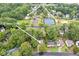 Aerial view of community amenities including a pool, tennis courts, and 722 Ivory Trail at 722 Ivory Trl, Woodstock, GA 30188
