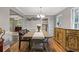 Cozy dining room featuring wood floors, buffet, and view of other living spaces at 722 Ivory Trl, Woodstock, GA 30188