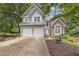 Charming two-story home with a two-car garage, stone accents, and well-maintained landscaping at 722 Ivory Trl, Woodstock, GA 30188
