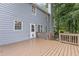 Exterior view of home showcasing the backyard deck and siding on a wooded lot at 722 Ivory Trl, Woodstock, GA 30188