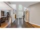 Bright, open foyer with hardwood floors, high ceilings, and a view of the living spaces at 722 Ivory Trl, Woodstock, GA 30188