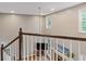 Upstairs loft features high ceilings and a view of the living room below at 722 Ivory Trl, Woodstock, GA 30188