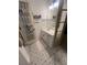 Bright bathroom with tiled floor, white vanity, and a well-lit mirror; a clean and functional space at 974 Bloomfield Dr, Lawrenceville, GA 30044