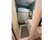 Compact bathroom features a neutral color scheme, a white vanity, and a shower with a patterned curtain at 974 Bloomfield Dr, Lawrenceville, GA 30044