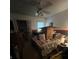 Bedroom with a ceiling fan, window, and a bed cluttered with boxes and personal belongings at 974 Bloomfield Dr, Lawrenceville, GA 30044