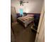 Cozy bedroom with colorful bedding, a twin-sized bed, and natural light, offering a comfortable private space at 974 Bloomfield Dr, Lawrenceville, GA 30044