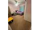 This bedroom features a calm atmosphere with pink walls, a full-size bed, and a soft beanbag chair at 974 Bloomfield Dr, Lawrenceville, GA 30044