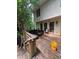 Rear exterior view with a wooden deck offering a space for outdoor dining and relaxation at 974 Bloomfield Dr, Lawrenceville, GA 30044