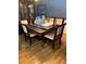 Traditional dining room with hardwood floors, elegant chairs, and space for entertaining at 974 Bloomfield Dr, Lawrenceville, GA 30044