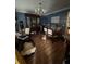 Dining room with hardwood flooring and a chandelier, needing decluttering at 974 Bloomfield Dr, Lawrenceville, GA 30044