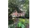 Charming brick home with blue shutters, landscaped yard, and an inviting front entrance at 974 Bloomfield Dr, Lawrenceville, GA 30044