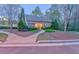 Charming single-story house with blue shutters, manicured landscaping, and inviting walkway at 974 Bloomfield Dr, Lawrenceville, GA 30044