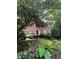 Charming brick home with mature landscaping, blue shutters and welcoming entrance, creating great curb appeal at 974 Bloomfield Dr, Lawrenceville, GA 30044