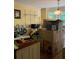 Kitchen with island, sink, faucet, and natural light. Boxes from moving cover the counter tops at 974 Bloomfield Dr, Lawrenceville, GA 30044