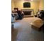 Inviting living room with a cozy fireplace, neutral carpet, and a traditional mantle at 974 Bloomfield Dr, Lawrenceville, GA 30044