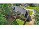 A spacious backyard with a wooden fence, deck, and ample space for outdoor activities and relaxation at 1048 Falls Brooke Dr, Conyers, GA 30094