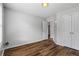 Minimal bedroom features laminate floors, neutral walls, and a closet at 1048 Falls Brooke Dr, Conyers, GA 30094