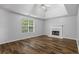 Spacious bedroom featuring a fireplace, neutral walls, and laminate flooring at 1048 Falls Brooke Dr, Conyers, GA 30094