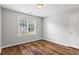 Simple bedroom offers natural light and laminate flooring for easy maintenance at 1048 Falls Brooke Dr, Conyers, GA 30094