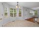 Cozy breakfast nook filled with light from large windows with a view of the back at 1048 Falls Brooke Dr, Conyers, GA 30094