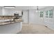 Spacious eat-in kitchen with modern appliances, granite countertops, and bright windows at 1048 Falls Brooke Dr, Conyers, GA 30094